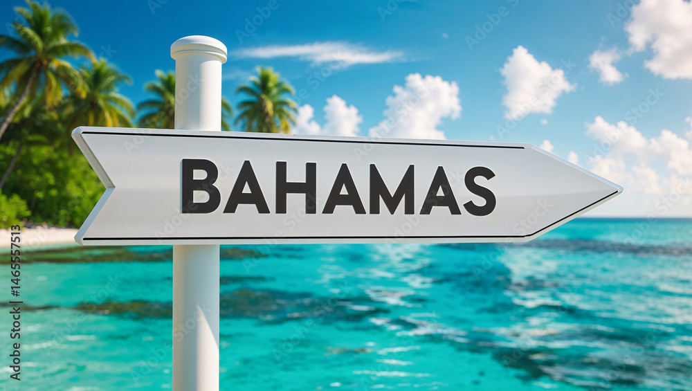 on a pole a direction arrow with the inscription Bahamas against the backdrop of a picturesque landscape in summer sea