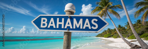 Obraz na płótnie on a pole a direction arrow with the inscription Bahamas against the backdrop of a picturesque landscape in summer sea
w salonie