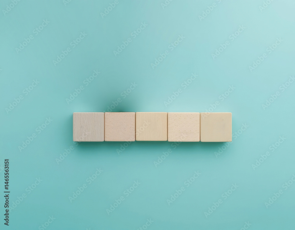 Blank Wooden Blocks Arranged on Turquoise Background for Text or Icons