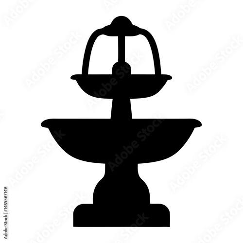 A monochromatic silhouette of a multi tiered decorative water fountain