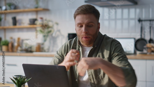 Obraz na płótnie Businessman arguing video call laptop holding work documents at home closeup. w salonie