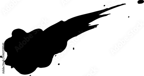 Elongated ink splash stretching in a single direction with trailing smudge lines and uneven flow.