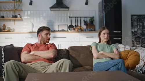 Obraz na płótnie Unhappy couple quarrel sitting home couch showing disagreement. Marriage crisis w salonie