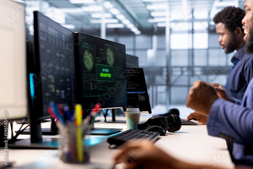 Obraz na płótnie Developer receiving access granted notification while reconfiguring server farm, optimizing it. Worker ensures data center operates efficiently, happy after successfully eliminating all errors w salonie
