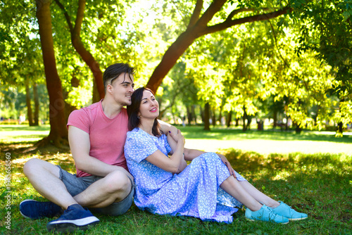 Young Adult Son and Mother Relaxing Together in Park