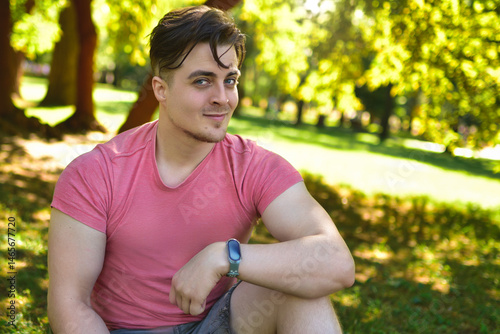 Close-up Portrait of Smiling Young Man in Park