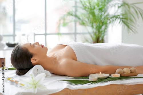 Young Asian woman relaxing ...