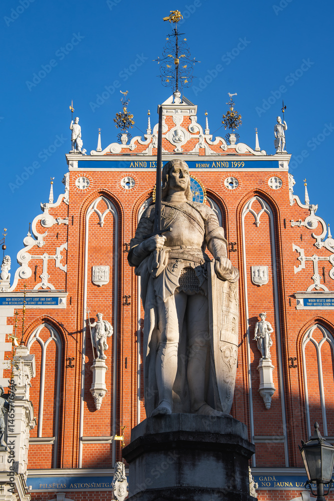 Statue of Knight and St. Peter's Church Spire in Riga, Latvia