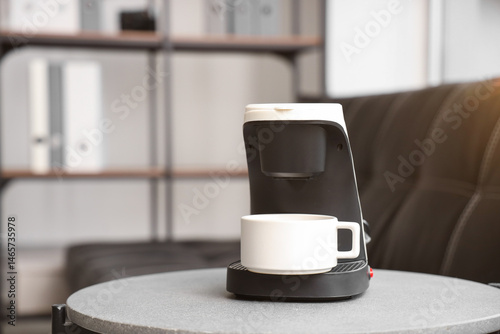 Coffee machine with cup on ...