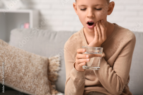 Little boy with glass of co...