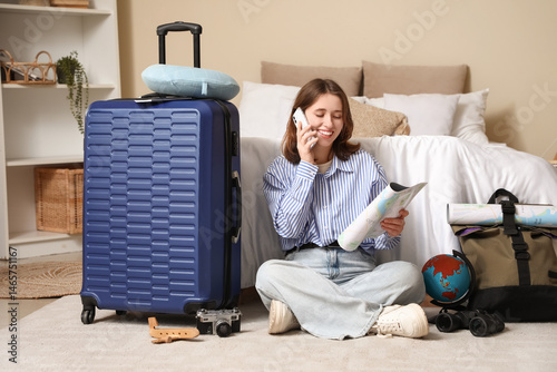 Female traveler with map ta...