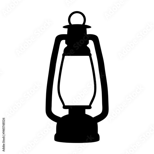 Silhouette of an Antique Kerosene Lantern Casting a Dramatic Shadow