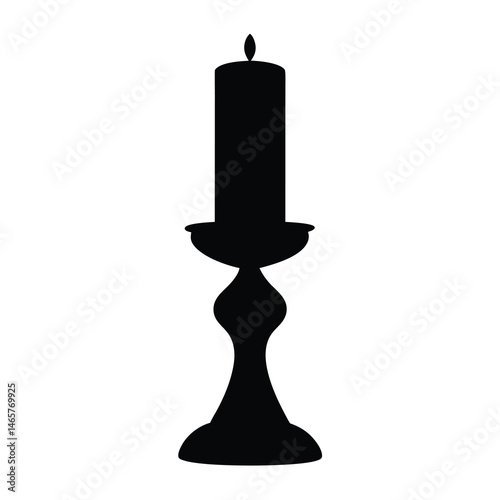 Elegant silhouette of a lit candle on a decorative candlestick holder