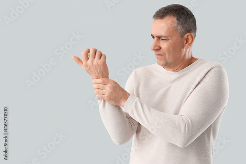 Mature man suffering from w...