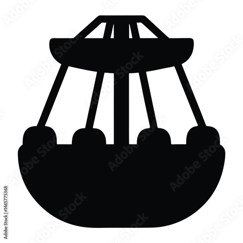 Silhouette of a Swing Ride in a Carnival or Amusement Park