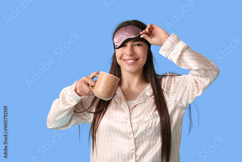 Young woman in pajamas with...