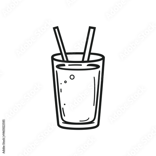 A clear glass filled with a liquid and two straws sits upright