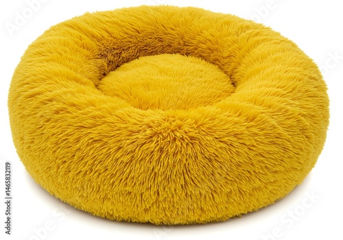 A fluffy yellow pet bed with a round shape and a sunken center on a plain white background surface