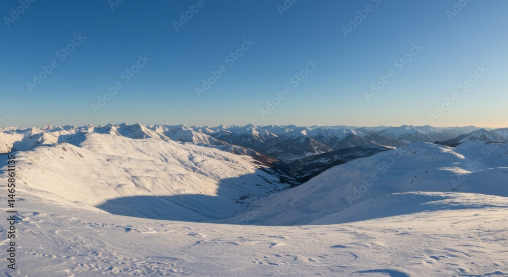 Panoramic View of Snowy Mountain Range under a Clear Blue Sky Panoramic View of Snowy Mountain Range under a Clear Blue Sky