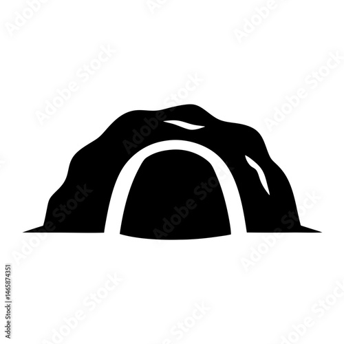 Silhouette of a cave entrance with rough texture above the opening