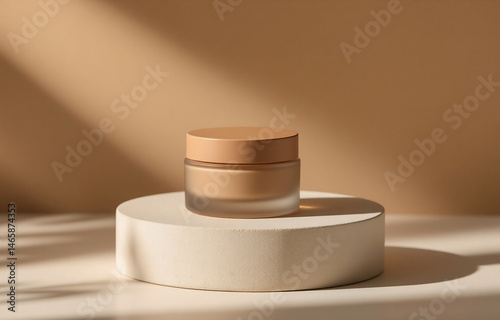 A beige cream jar sits on a minimalist white pedestal, bathed in warm, sunlight.  The scene evokes serenity and natural beauty.