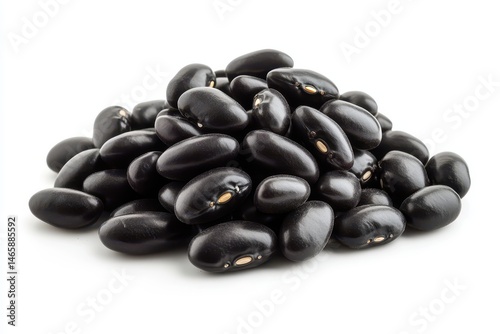 Pile of raw black beans on a white background ready for cooking