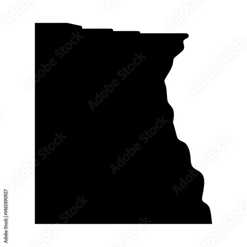 Black silhouette of a rocky cliff with visible layers and overhang