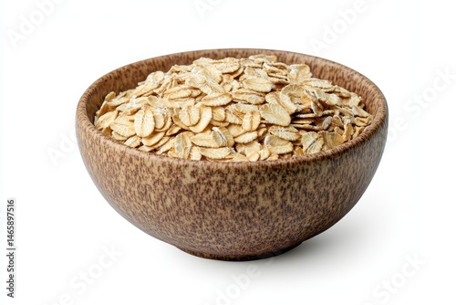 Rolled oats in a rustic bowl against a white background