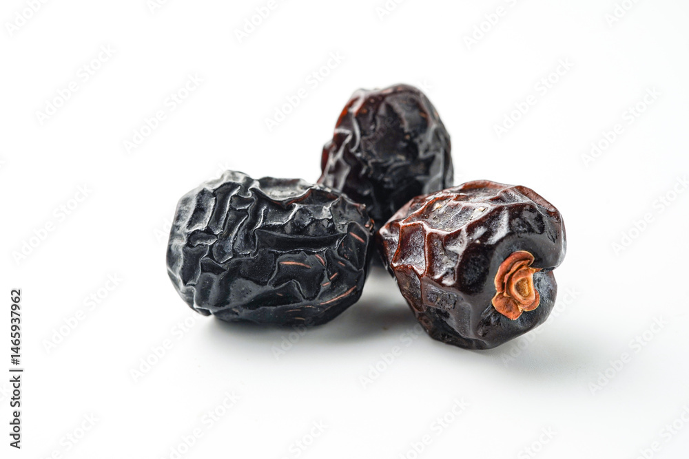 Dates fruit ajwa or kurma ajwa, isolated on white background Dates fruit ajwa or kurma ajwa, isolated on white background