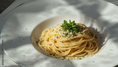 Delicious plate of spaghetti topped with fresh parsley and grated cheese. Perfect for food lovers and culinary enthusiasts. Easy and elegant meal idea.