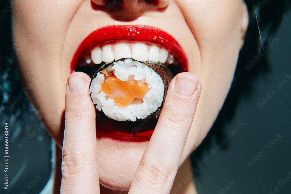 Close-up of a woman enjoying sushi, showcasing vibrant red lips and textured sushi, highlighting emotions and food culture.