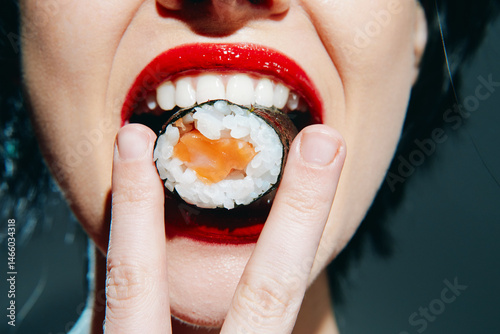Close-up of a woman enjoying sushi, showcasing vibrant red lips and textured sushi, highlighting emotions and food culture.