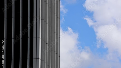 Clouds Blow Behind Older Skyscraper