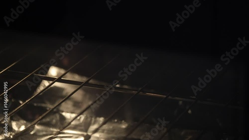 Placing Frozen Pizza Into An Oven
