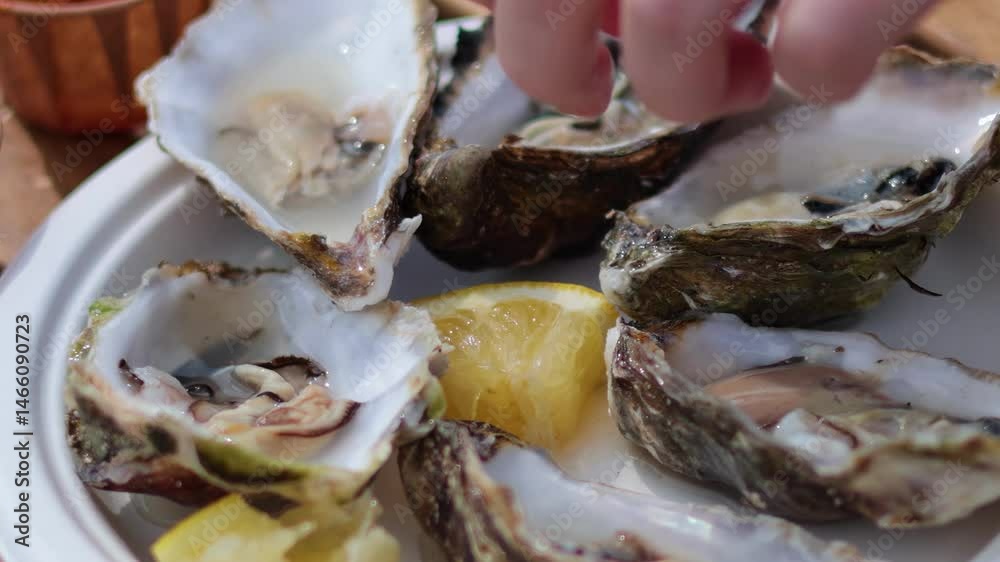 Savoring Fresh Oysters with Lemon Squeeze Savoring Fresh Oysters with Lemon Squeeze