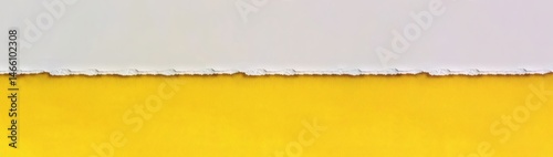 yellow textured paper beneath white sheet
