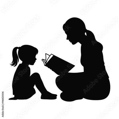 Silhouette of a Mother Reading a Book to Her Daughter