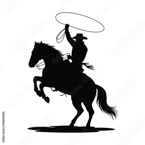 Silhouette of a Cowboy Lassoing on a Bucking Bronco