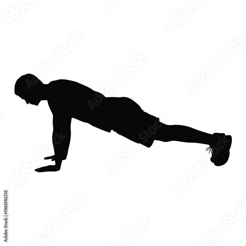 Silhouette of a Man Performing a Plank Exercise
