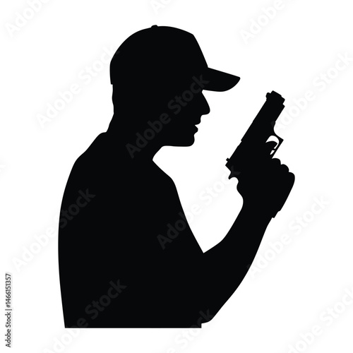 Silhouette of a Man in a Cap Holding a Handgun
