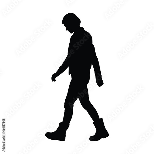 Silhouette of a Person Walking in Boots and Jacket