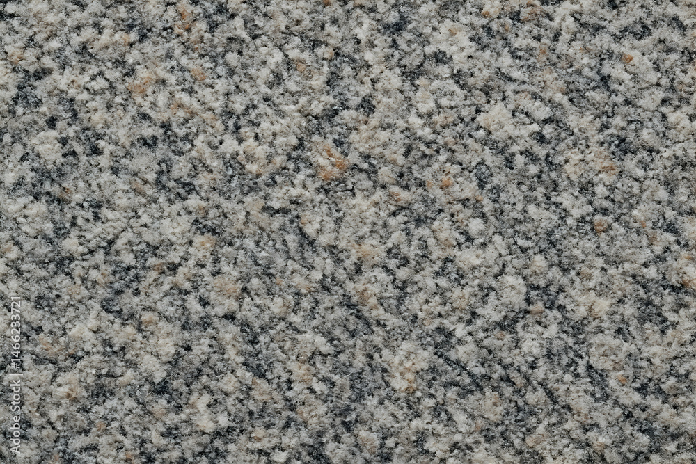 Textured gray granite stone surface pattern.