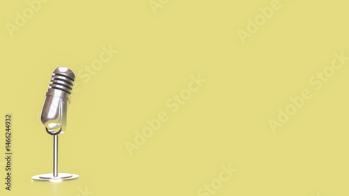 The Vintage microphone on yellow Background 3d Rendering. photo