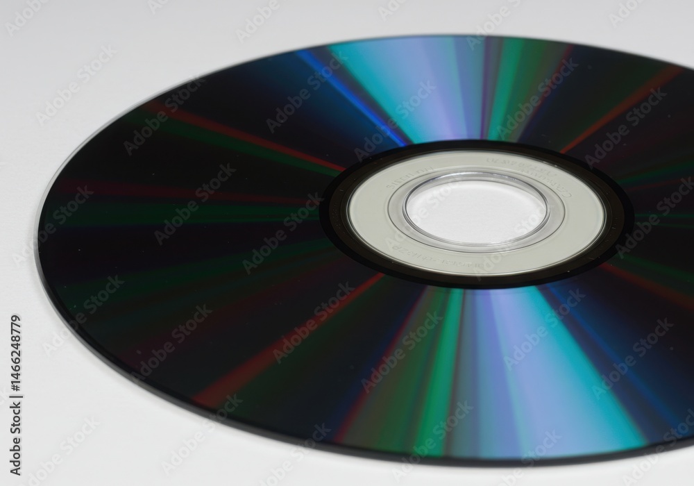 A compact disc with colorful light reflections isolated on white background A compact disc with colorful light reflections isolated on white background