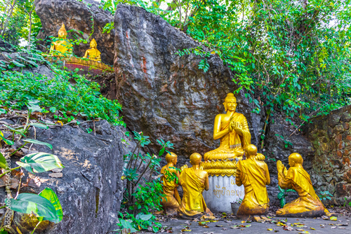 Golden buddha statues Phousi Hill Wat Chom Si Luang Prabang.