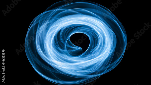 Abstract light blue swirl of energy on black background for technology or science concepts and backgrounds with futuristic design