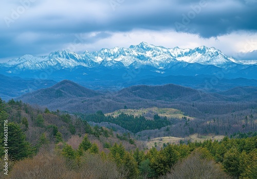 Snow Capped Mountains Under a Dramatic Cloudy Sky