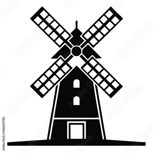 Silhouette of a vintage windmill with turning sails stands against a stark white background