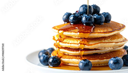 Fluffy pancakes with fresh blueberries and drizzled syrup, a delicious breakfast treat