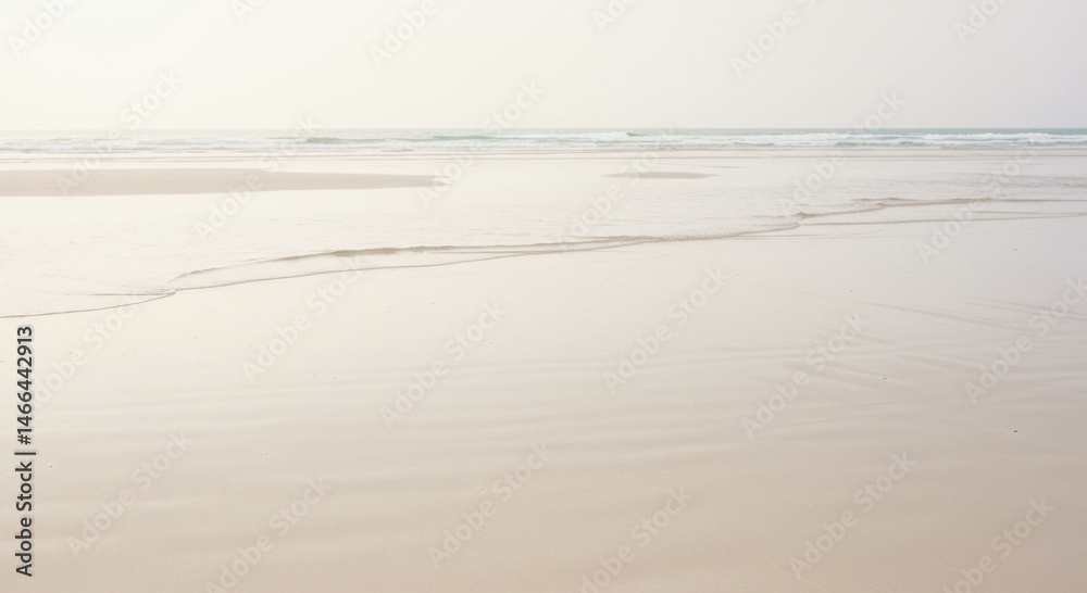 Peaceful Beach Scene with Soft Light and Subtle Footprints Peaceful Beach Scene with Soft Light and Subtle Footprints